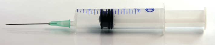 syringe and needle closeup medical concepts horizontal